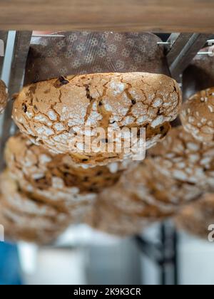 panettone cooking secrets concept hanging up down in the kitchen Stock Photo