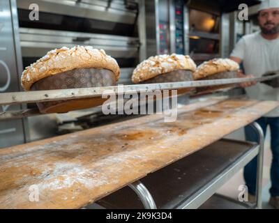 panettone cooking secrets concept hanging up down in the kitchen Stock Photo