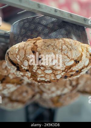 panettone cooking secrets concept hanging up down in the kitchen Stock Photo