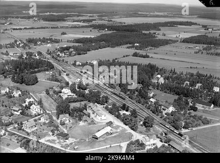 Aerial photo over station unit before 1/10 1900 'Karlskoga'. The station was built in 1870. Two -storey station house in brick. The residential apartment was renovated in 1948. The station remote controlled (Fr Hallsberg) since 1974. NBJ had a locomotive here. Opened 1/12 1873 as 'Karlskoga' station, fined the name to 'Strömtorp' 1/10 1900, was loaded 22/5 in 1966, but remained as a traffic engineering station. Abolished as a loading area, but remaining as traffic engineering station 18/6 1973. The station house sold in 1977 Stock Photo