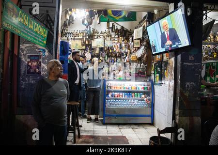 Rio De Janeiro, Brazil. 28th Oct, 2022. In a bar in the Lapa district, people watch the last TV debate between the two presidential candidates da Silva and Bolsonaro. Credit: Fernando Souza/dpa/Alamy Live News Stock Photo