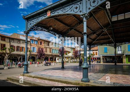 The covered market hall and the half timbered medieval houses on the main square of Mirepoix, in the South of France (Ariege) Stock Photo