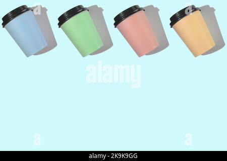 Four multi-colored cardboard coffee cups with a plastic lid on a blue background. Template with copy space. The concept of ecology, recycling, environmental protection. Stock Photo