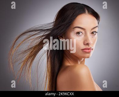 Beauty, face and vitiligo with a model woman in studio on a gray background to promote skincare. Wellness, luxury and portrait with an attractive Stock Photo