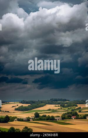 Storm clouds over hills and farmland. Roztocze, Poland Stock Photo