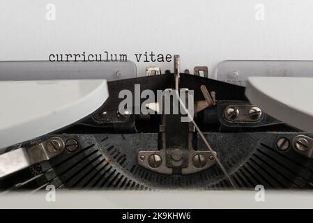 close-up of words CURRICULUM VITAE written on old mechanical typewriter Stock Photo