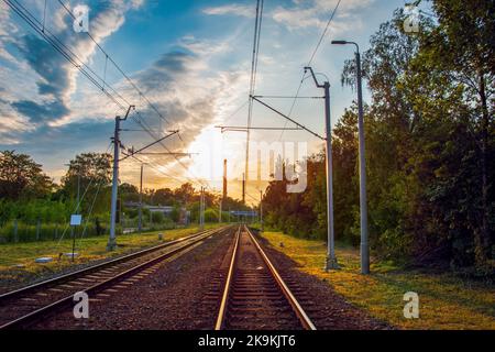 Railway line in the city at sunset. Siemianowice Śląskie, Poland Stock Photo