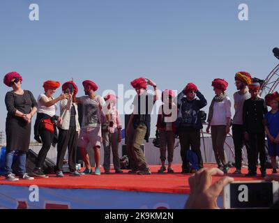 Bikaner Rajasthan, India : January 14, 2018 – turban tying competition, foreigners participate at Bikaner festival. Stock Photo