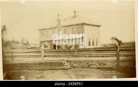 Stins E.jungberg on the platform during the clock station was built in 1874. In 1934 the station house was rebuilt. Stock Photo