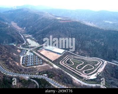 (221029) -- XI'AN, Oct. 29, 2022 (Xinhua) -- This aerial photo taken on Oct. 26, 2022 shows a view of a demonstration area for ecological agriculture in Nangou Village of Yan'an, northwest China's Shaanxi Province. Covering an area of 24 square kilometers, the Nangou Village is home to more than 1,000 villagers. Led by the village's Party branch, Nangou has worked out ways to inject vitality into the countryside. It has witnessed the boom of planting and breeding industries and rural tourism. Villagers have constantly increased their income by earning dividends and taking odd jobs during the s Stock Photo