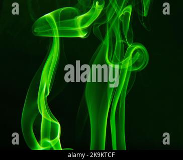 Smoke from incense stick isolated on a black background. Stock Photo