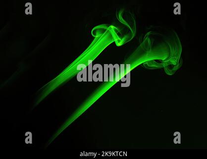 Smoke from incense stick isolated on a black background. Stock Photo