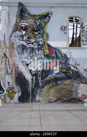 A vertical shot of an urban art mural graffiti of a fox in Lisbon, made by Artur Bordalo Stock Photo