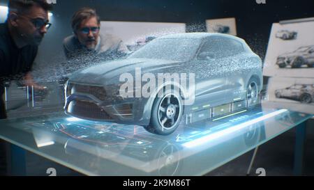 Two male engineers using digital tablet App, developing 3D model of a sustainable eco friendly electric vehicle. Designers testing car bodys air streamline properties testing aerodynamic parameters Stock Photo