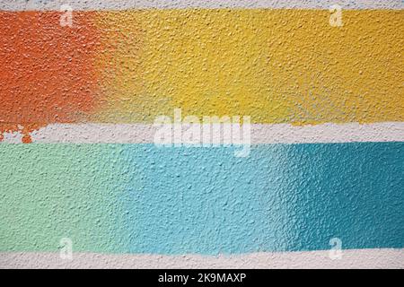 Striped Textured Multi-Color lines on a Wall - Yellow Orange Teal Baby Blue Turquoise with a Smudge Stock Photo