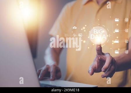Big data concept. Businessman hand touch hologram screen technology with notebook (Laptop). AI (Artificial intelligence) concept. Business technology Stock Photo