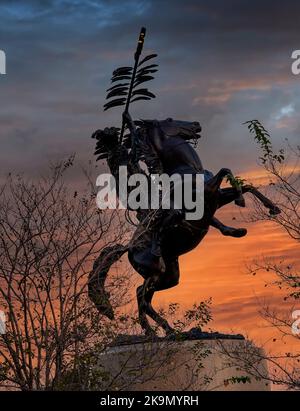 Tallahassee, Florida - October 27, 2012: The bronze sculpture by Fritz White symbolizes a spear-brandishing Seminole astride a rearing horse. Stock Photo