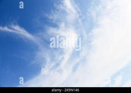 White cirro-cumulus clouds in soft blue sky Stock Photo