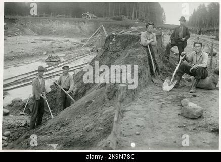 The railing at Prästeryds station. Navvy. Decauville tracks, the finished rail lengths were used as provisional paths for track work vehicles. Stock Photo