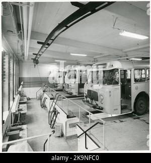 State Railways, SJ Bus 2638 with registration number F460 and SJ Buses 3098, 2780 in a car repair shop. Stock Photo
