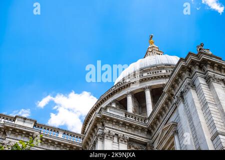Looking up low angle view on St. Paul's Cathedral church with dome cross in summer at City of London, UK Stock Photo