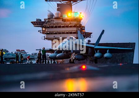 An F/A-18E Super Hornet attached to the “Fighting Checkmates” of Strike Fighter Squadron (VFA) 211 prepares to launch from the flight deck of the Nimitz-class aircraft carrier USS Harry S. Truman (CVN 75) Stock Photo