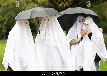 Manchester, UK. 29th Oct, 2022. World record attempt as number of people dressed as ghosts at Platt Fields Park in Manchester. The attempt orgainsed by Paranormal Rescue raised money for the dogs charity Greyhound Gap. The attempt fell short of the world record which organisers blamed on the inclement weather and recent stabbing nearby outside student accomodation at Owens Park student accomodation in Fallowfield. Credit: GaryRobertsphotography/Ģ����ý Live News Stock Photo