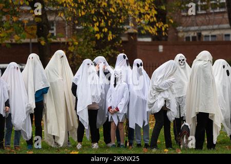 Manchester, UK. 29th Oct, 2022. World record attempt as number of people dressed as ghosts at Platt Fields Park in Manchester. The attempt orgainsed by Paranormal Rescue raised money for the dogs charity Greyhound Gap. The attempt fell short of the world record which organisers blamed on the inclement weather and recent stabbing nearby outside student accomodation at Owens Park student accomodation in Fallowfield. Credit: GaryRobertsphotography/Ģ����ý Live News Stock Photo