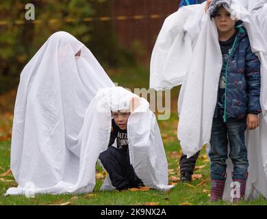 Manchester, UK. 29th Oct, 2022. World record attempt as number of people dressed as ghosts at Platt Fields Park in Manchester. The attempt orgainsed by Paranormal Rescue raised money for the dogs charity Greyhound Gap. The attempt fell short of the world record which organisers blamed on the inclement weather and recent stabbing nearby outside student accomodation at Owens Park student accomodation in Fallowfield. Credit: GaryRobertsphotography/Ģ����ý Live News Stock Photo