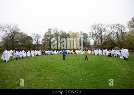 Manchester, UK. 29th Oct, 2022. World record attempt as number of people dressed as ghosts at Platt Fields Park in Manchester. The attempt orgainsed by Paranormal Rescue raised money for the dogs charity Greyhound Gap. The attempt fell short of the world record which organisers blamed on the inclement weather and recent stabbing nearby outside student accomodation at Owens Park student accomodation in Fallowfield. Credit: GaryRobertsphotography/Ģ����ý Live News Stock Photo