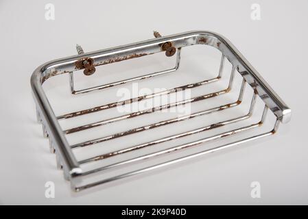 Rusty chrome soap holder on a white background Stock Photo