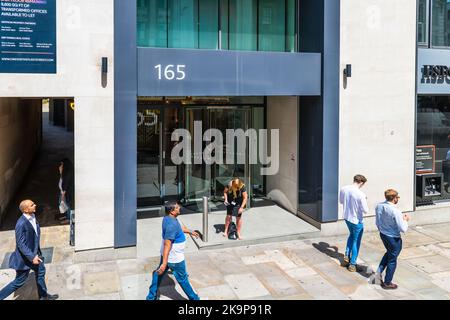London, United Kingdom - June 22, 2018: Above high angle view on Fleet street sidewalk with business people walking by HSBC corporate bank office Stock Photo