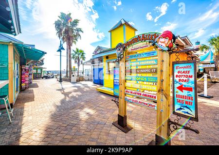 Destin, USA - January 13, 2021: Okaloosa beach city sign for Harbor Boardwalk Pirate's Alley on sunny winter day in Florida panhandle Gulf of mexico Stock Photo