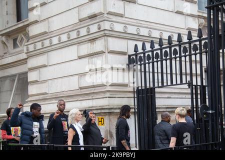 London, UK. 29th Oct, 2022. Family members of people who died while in police custody enter Downing street to deliver a petition. Protesters took part in the annual procession by the United Families and Friends Campaign where demonstrators marched from Trafalgar Square to Downing Street demanding Justice for victims of deaths while in police custody. Credit: SOPA Images Limited/Alamy Live News Stock Photo