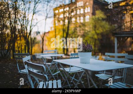 Close up of a white table at outdoor restaurant Stock Photo