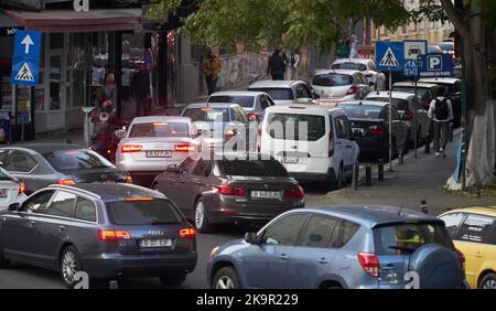 Bucharest, Romania - October 18, 2022: Cars in traffic at rush hour on a street in downtown Bucharest. Stock Photo