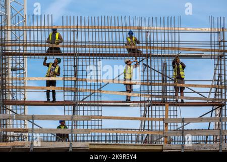 Budapest, Hungary - 2 September 2022: Workers on iron scaffolding at construction site Stock Photo