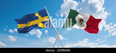 two crossed flags Mexico and Sweden waving in wind at cloudy sky. Concept of relationship, dialog, travelling between two countries. 3d illustration Stock Photo