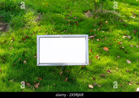 Ad billboard standing in a field of grass Stock Photo