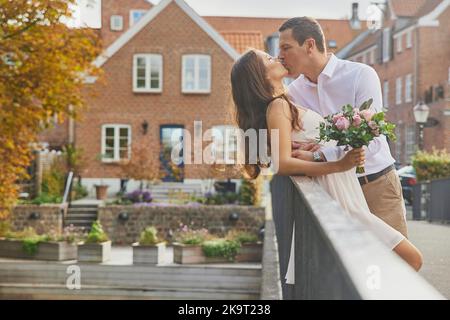 Ribe, Denmark, October,2022: couple in love walking in the autumn city Stock Photo