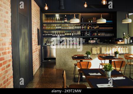 An empty cafe filled with chairs and tables along with interior ...