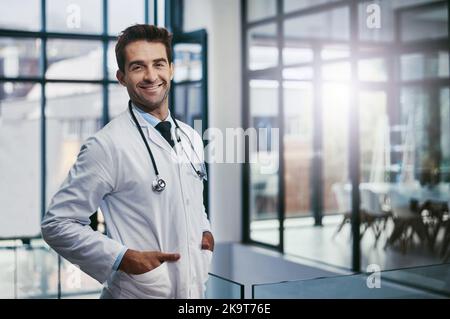 Some angels have wings, some have stethoscopes. Portrait of a young handsome male medical practitioner working in a hospital. Stock Photo