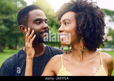 Look at me...I love you. an affectionate young couple spending some time together in the park. Stock Photo