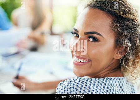 Im confident and ecstatic for the success we will see today. Portrait of a young businesswoman having a meeting with her colleagues outdoors. Stock Photo