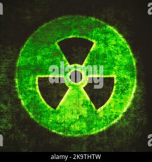 Radiation sign, green on black. Nuclear hazard emblem, grunge textured. Radioactive threat symbol Stock Photo