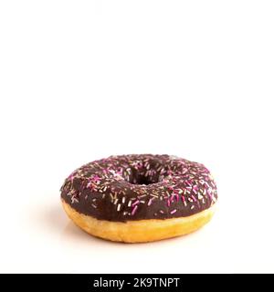Close up of donut with sprinkle on white isolated background. Copy space Stock Photo