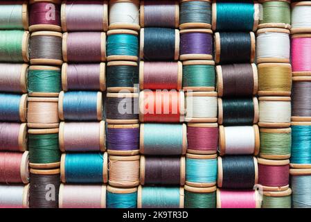 Multi-colored spools of thread close-up Stock Photo