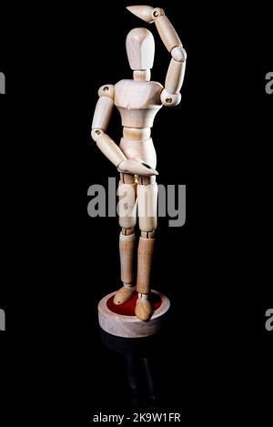 Image of falling wooden manikin on black background, wooden manikin poses different posing Stock Photo