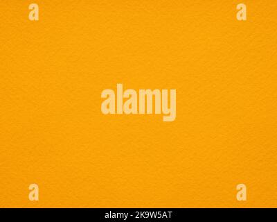 Background of bright Orange felt. Yellow cotton textile close up of fabric texture. Saturated background for seasonal decoration, text, lettering Stock Photo