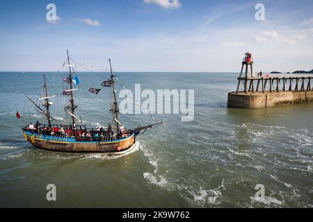 WHITBY, UK - September 21, 2022. HM Bark Endeavour, a replica of Captain Cook's ship, sailing into Whitby Harbour Stock Photo